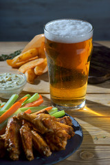 fried chicken wings with a glass of beer
