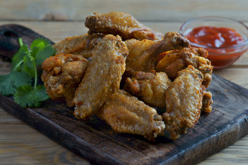 fried chicken wings with vegetables