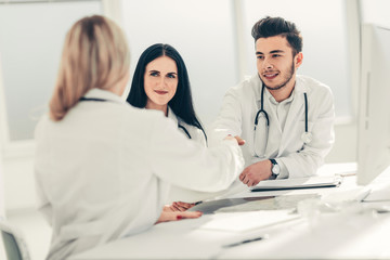 Fototapeta premium handshake of medical doctors at the Desk .