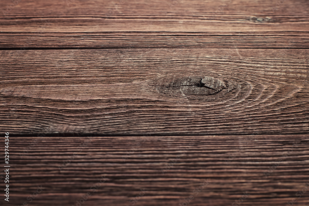 Wall mural side view of the surface of an old rustic wooden table with shallow depth of field. abstract trendy 