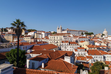 Fototapeta na wymiar Church of Sao Vicente of Fora (Igreja de Sao Vicente de Fora) and old buildings in Alfama and Graca districts in Lisbon, Portugal.