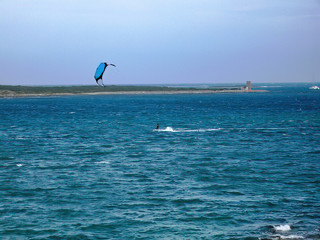 kite surfer surf wave in sardinia
