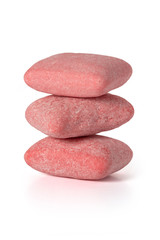 Three pads of pink strawberry chewing gum stand upright on a white background