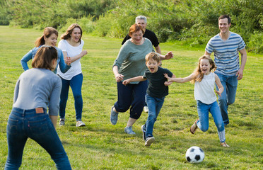people of different ages playing football