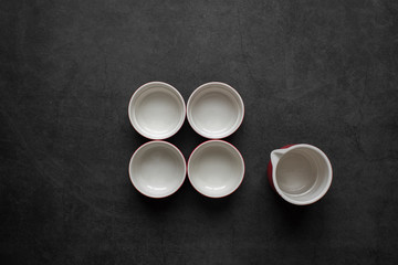 Empty Cup of tea on dark gray background,top view.