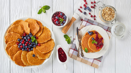 oatmeal pancakes on a plate with berries