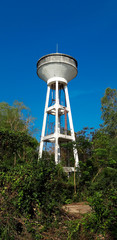 Old water tower made of concrete.