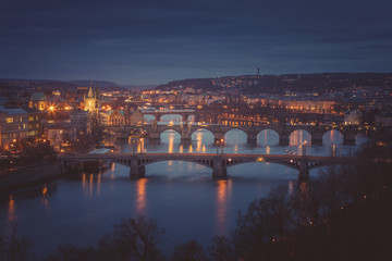 Fototapeta na wymiar Moody evening in Prague. Seven bridges on Vltava river view from Letna Hill