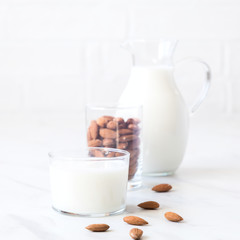 Almond milk in a glass jug .Drink for vegetarians.