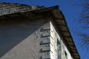 corner of an old stone house with architectural accents