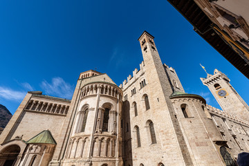 Fototapeta na wymiar Trento city, San Vigilio Cathedral (Duomo di Trento, 1212-1321) and the medieval clock tower of the Palazzo Pretorio (Praetorian Palace and Civic Tower). Trentino-Alto Adige, Italy, Europe