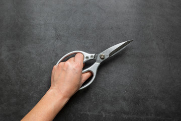 Scissors for sewing isolated on dark background. 