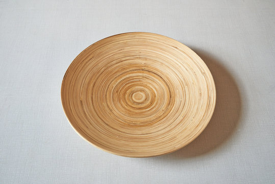 African plate on textured and striped table