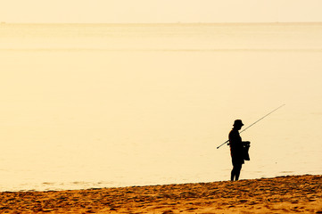 fishermen fishing the cooking food in the seaside dawn