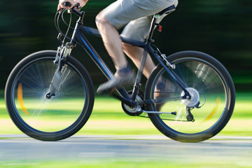 Riding bicycle - blurred motion, fast driving.
