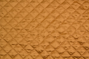 Fototapeta premium Fabric velour quilted close-up. Quilted surface upholstery