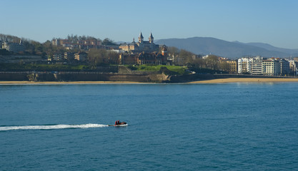 Fototapeta na wymiar Jet ski in La Concha bay, city of Donostia, Euskadi, Spain