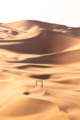 An abrstract view of a frame in the middle of the dunes in the desert
