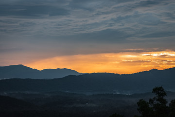 Misty mountains range with amazing sky