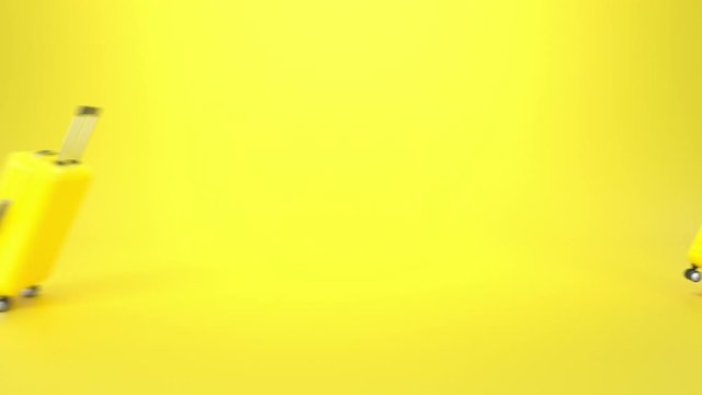Abstract 3D render of yellow suitcase on yellow background rotating and rolling around. Animation travel concept. 4k footage.