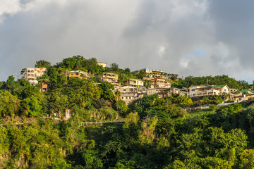 Fototapeta na wymiar Coastline view with lots of living houses on the hill, Kingstown, Saint Vincent and the Grenadines