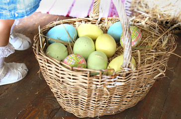 Easter basket full of colorful eggs, close-up, Easter holiday