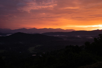 Misty mountains range with amazing sky