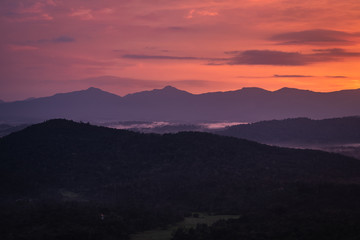 Misty mountains range with amazing sky