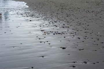 footprints of water on the beach