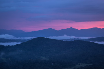 Misty mountains range with amazing sky