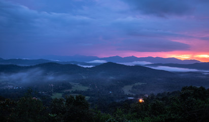 Misty mountains range with amazing sky