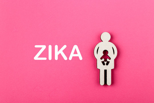 Zika Virus Concept. Mother And Child. Pregnancy. Wooden Figure.