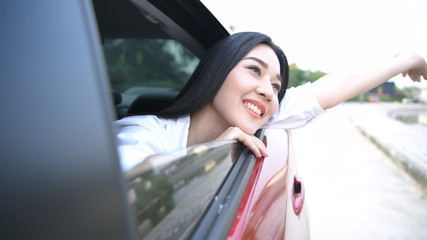 Travel Concept. Beautiful Asian women are happily enjoying the roadside view. 4k Resolution.