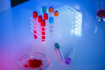 A medical professional, laboratory assistant, doctor performs an analysis in a laboratory, uses...