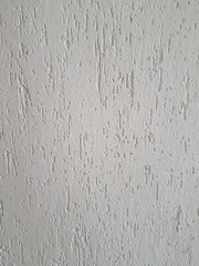 close up. fragment of white non-woven Wallpaper.