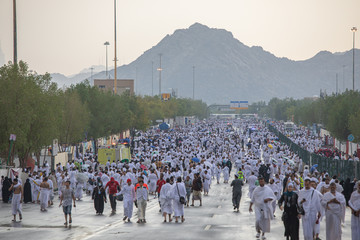Hajj pilgrims walking, Day time, Performing Hajj, Mina, Makkah, Saudi Arabia, August 2019