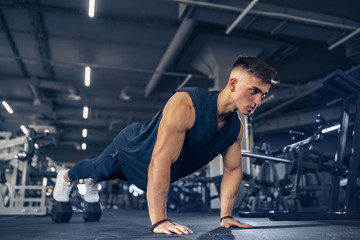 Young Adult Athlete Doing Push Ups As Part Of Bodybuilding Training.