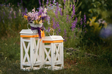 lantern and bouquet flowers in the  basket