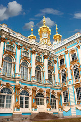 A fragment of the facade of the Catherine’s Palace in the city of Pushkin near St. Petersburg, richly decorated with stucco molding