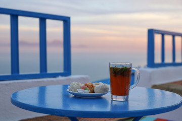 Tea and tunisian pastries on a table in Sidi Bou Said in Tunisia 