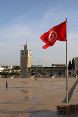 Tunisian flags flying in the wind on the Kasbah square in Tunis