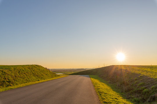 spring season shinning sunrise on a raod pathway beauty of the nature