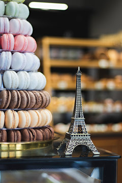 Eiffel tower miniature and colored macarons. France souvenir