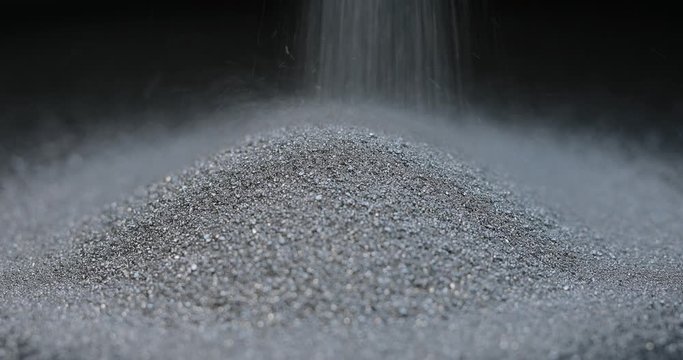 Silver mining, sprinkle fraction of rare metal on black background