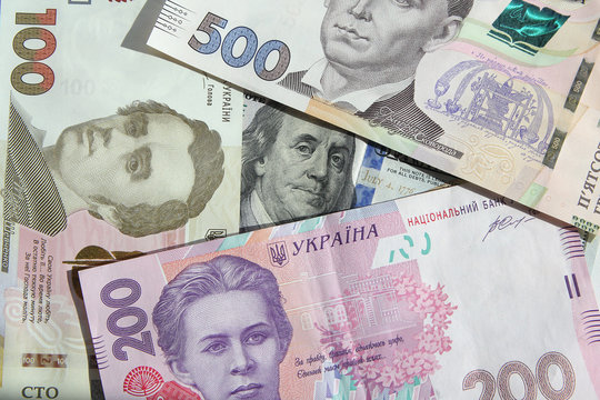 Ukrainian money - hryvnia banknotes USA dollars bills. Finance in Ukraine, of the hryvnia to the dollar exchange rate
