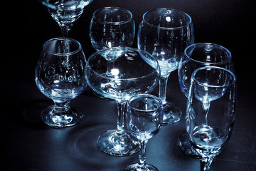 Empty  glasses for drinks on dark background