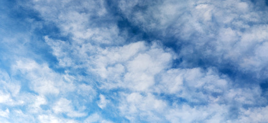 Backgrounds and textures. Blue beautiful sky with clouds.
