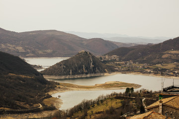 Mountain lake Lago del Turano near Rieti in Italy. Picturesque landscape on Lake Turano with Castel...