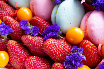gift box with berries and macaroons