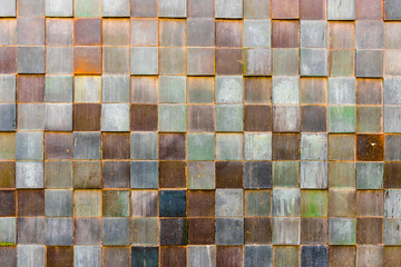 Old ceramic tiles on a wall in Budapest.